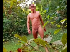 Gay Myanmar man goes naked in the woods with an anal plug.
