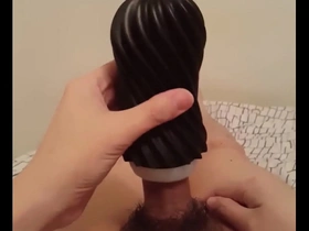 Asian stud gets a satisfying handjob and facial with Tenga Flex