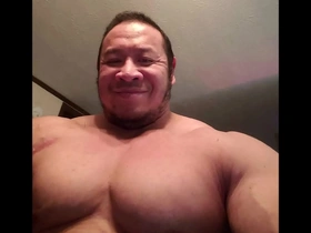 Young Asian bodybuilder shows off his muscles.