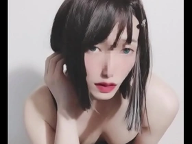Cross dressing Japanese beauty in female attire