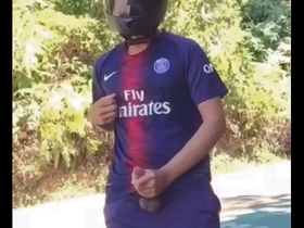 Public solo pleasure of a biker football player in Thailand