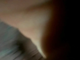 A young gay man enjoys anal play with a dildo alone.