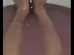Magenta slime bath for a male model.