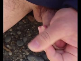 Gay Japanese man masturbates outdoors and ejaculates on the beach