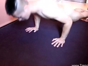 A muscular Asian man posing and flexing his muscles.