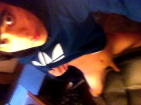 Young Asian boy with emo look and a small penis pleasuring himself on a chair.