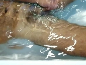 Solo Indian stallion enjoys a hot bath and a hand job.