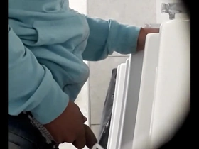 Big dick gay pissing scene in a urinal
