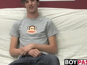 Danny, a cute gay guy, masturbates on the couch.