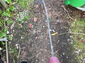 Solo boy urinates in the garden outdoors on 10th April 2021