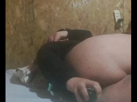 Young gay guy enjoys being anally stimulated with a bottle
