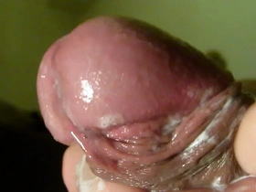Solo boy’s close up masturbation scene with a red penis glory shot.