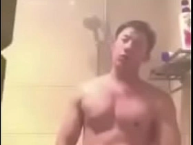 Asian man performing solo on webcam