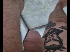 Solo performance of a gay man urinating on camera.