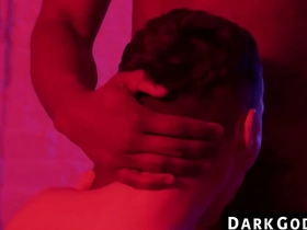 A skinny gay guy gets dominated by a black man in an interracial scene at DarkGodz.com.