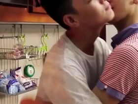 Young Asian boy’s first kiss with another gay man